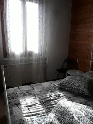 Letto o letti in una camera di Room Family
