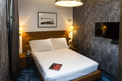 Letto o letti in una camera di Riva del Vin BOUTIQUE HOTEL