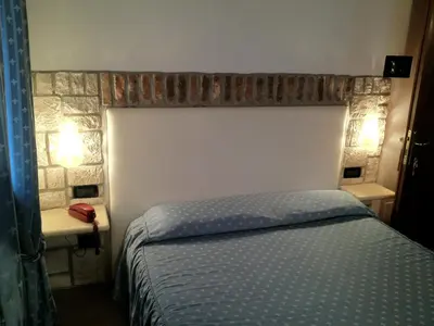 Letto o letti in una camera di Ca'Nova Alloggi