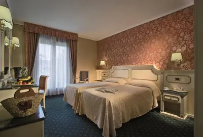 Letto o letti in una camera di Palace Hotel Meggiorato