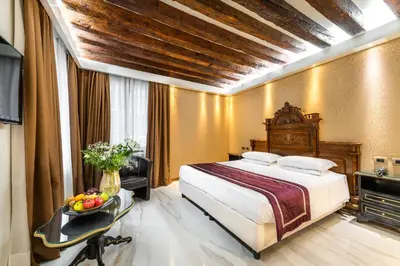 Letto o letti in una camera di Palazzo San Lorenzo