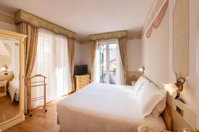 Letto o letti in una camera di Majestic Toscanelli (centro storico)