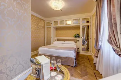 Letto o letti in una camera di Hotel Ai Reali - Small Luxury Hotels of the World