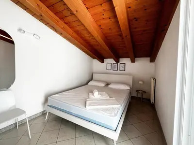 Letto o letti in una camera di Dainese Apartments, Casa Abigail