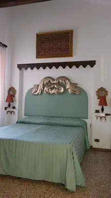 Letto o letti in una camera di Piccolo appartamento a San Marco