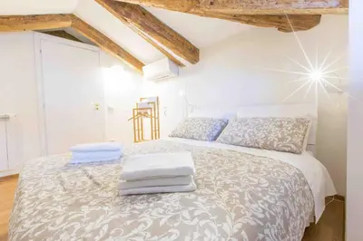 Letto o letti in una camera di CA GRIMANI Double Apartment: private terrace and stunning view