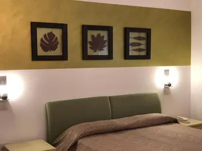 Letto o letti in una camera di Hotel Angi