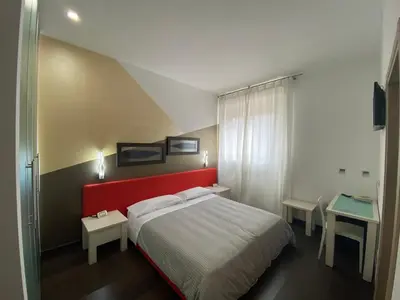Letto o letti in una camera di Hotel Angi