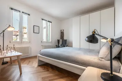 Letto o letti in una camera di La Bricola Terrace Apartment