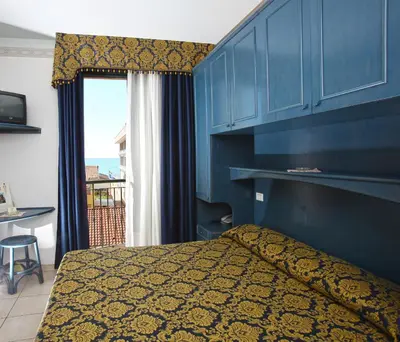 Letto o letti in una camera di Hotel Garni San Carlo