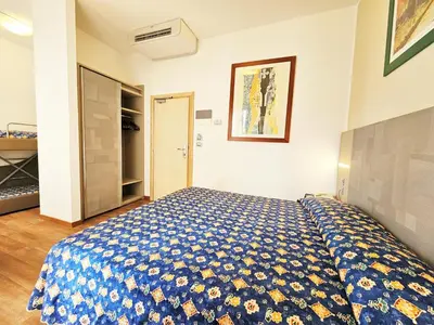 Letto o letti in una camera di Hotel Ornella