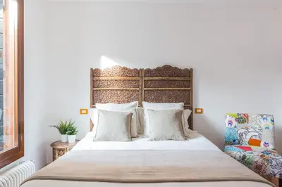 Letto o letti in una camera di Studio Ago27 by Welc(H)ome