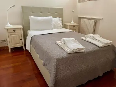Letto o letti in una camera di Palazzo Bianchetti