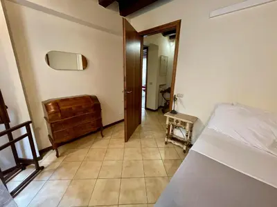 Letto o letti in una camera di Palazzo Bianchetti