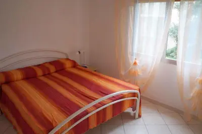 Letto o letti in una camera di Apartments in Rosolina Mare 35721