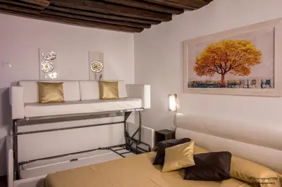 Letto o letti in una camera di Golden Suite
