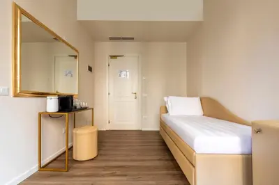 Letto o letti in una camera di Numa Venice Palazzo Orseolo