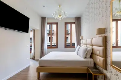 Letto o letti in una camera di Numa Venice Palazzo Orseolo