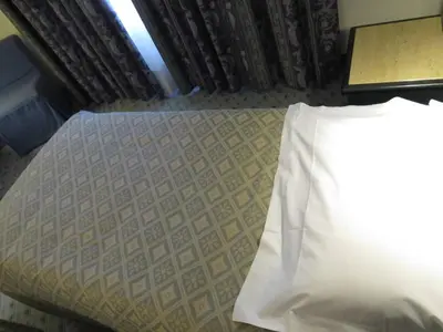 Letto o letti in una camera di Hotel Turandot-Osteria-Pizzeria 