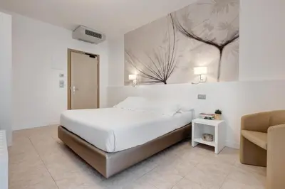 Letto o letti in una camera di Hotel Nettuno