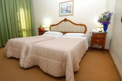 Letto o letti in una camera di Hotel Il Burchiello
