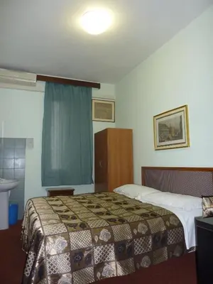 Letto o letti in una camera di Albergo Junior