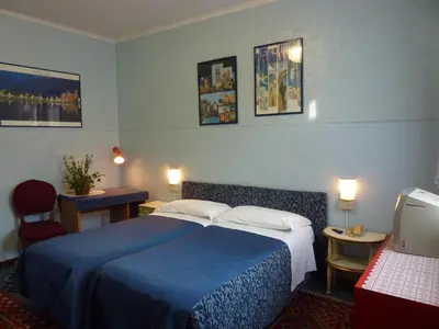 Letto o letti in una camera di Albergo Junior