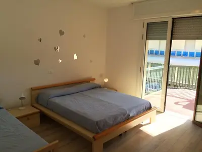Letto o letti in una camera di RESIDENCE PANFILO - WALTERIGATO Apartments SOLO PER FAMIGLIE
