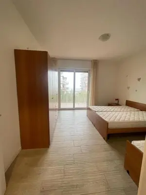 Letto o letti in una camera di RESIDENCE PANFILO - WALTERIGATO Apartments SOLO PER FAMIGLIE