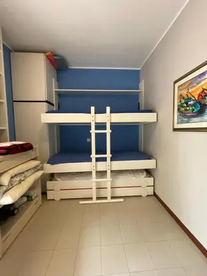 Letto o letti in una camera di RESIDENCE PANFILO - WALTERIGATO Apartments SOLO PER FAMIGLIE