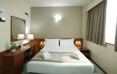 Letto o letti in una camera di ALA Hotel