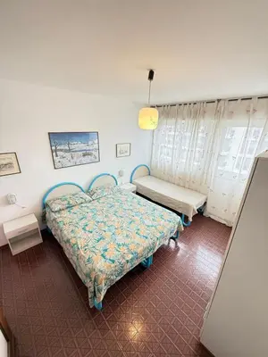Letto o letti in una camera di RESIDENCE MARINA MARCONI - WALTERIGATO Apartments SOLO PER FAMIGLIE