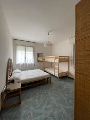 Letto o letti in una camera di CONDOMINIO CANSIGLIO- Walterigato Apartments- Solo per Famiglie
