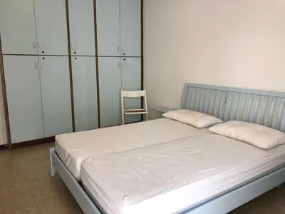 Letto o letti in una camera di RESIDENCE CENTRO COMMERCIALE - WALTERIGATO Apartments SOLO PER FAMIGLIE