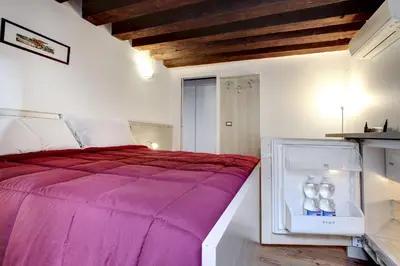 Letto o letti in una camera di Residenza Valier - Rialto by Wonderful Italy