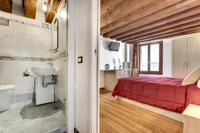 Letto o letti in una camera di Residenza Valier - Rialto by Wonderful Italy