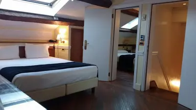 Letto o letti in una camera di Alloggi Arlecchino