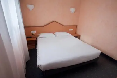 Letto o letti in una camera di Hotel Le Sorgenti