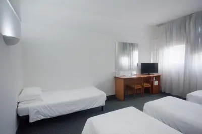 Letto o letti in una camera di Hotel Le Sorgenti