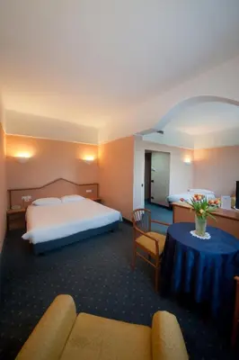 Letto o letti in una camera di Hotel Le Sorgenti
