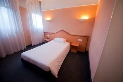 Letto o letti in una camera di Hotel Le Sorgenti