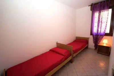Letto o letti in una camera di Apartments in Rosolina Mare 33097