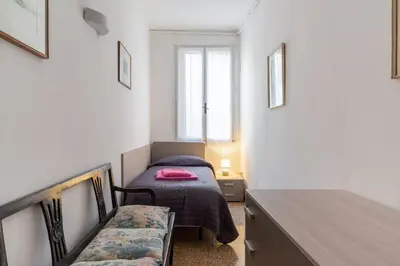 Letto o letti in una camera di Residenza San Marco 4893
