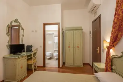 Letto o letti in una camera di Hotel al Sotoportego
