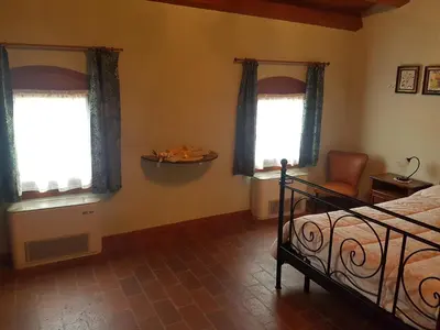 Letto o letti in una camera di agriturismo la scuderia