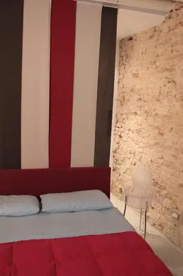 Letto o letti in una camera di Venetian Apartments