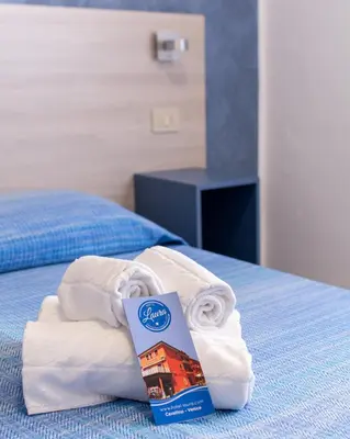 Letto o letti in una camera di Hotel Laura