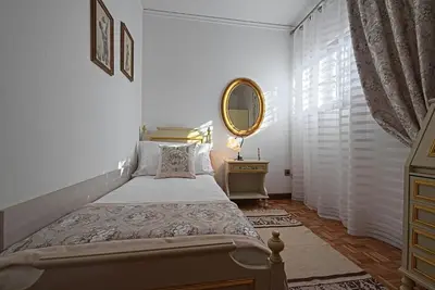 Letto o letti in una camera di VECCHIA FAVOLA HOUSE