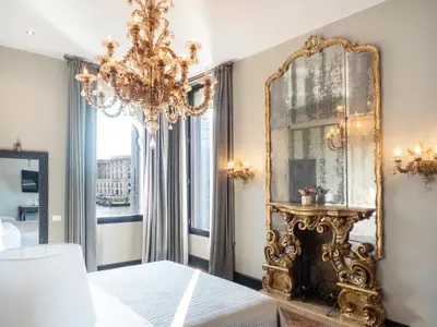 Letto o letti in una camera di Palazzetto Foscari