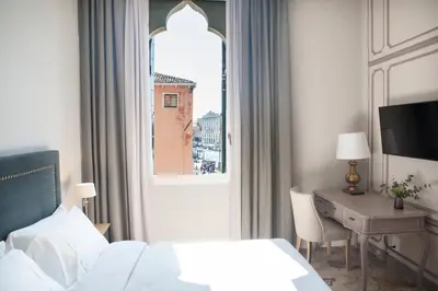 Letto o letti in una camera di Palazzetto Foscari